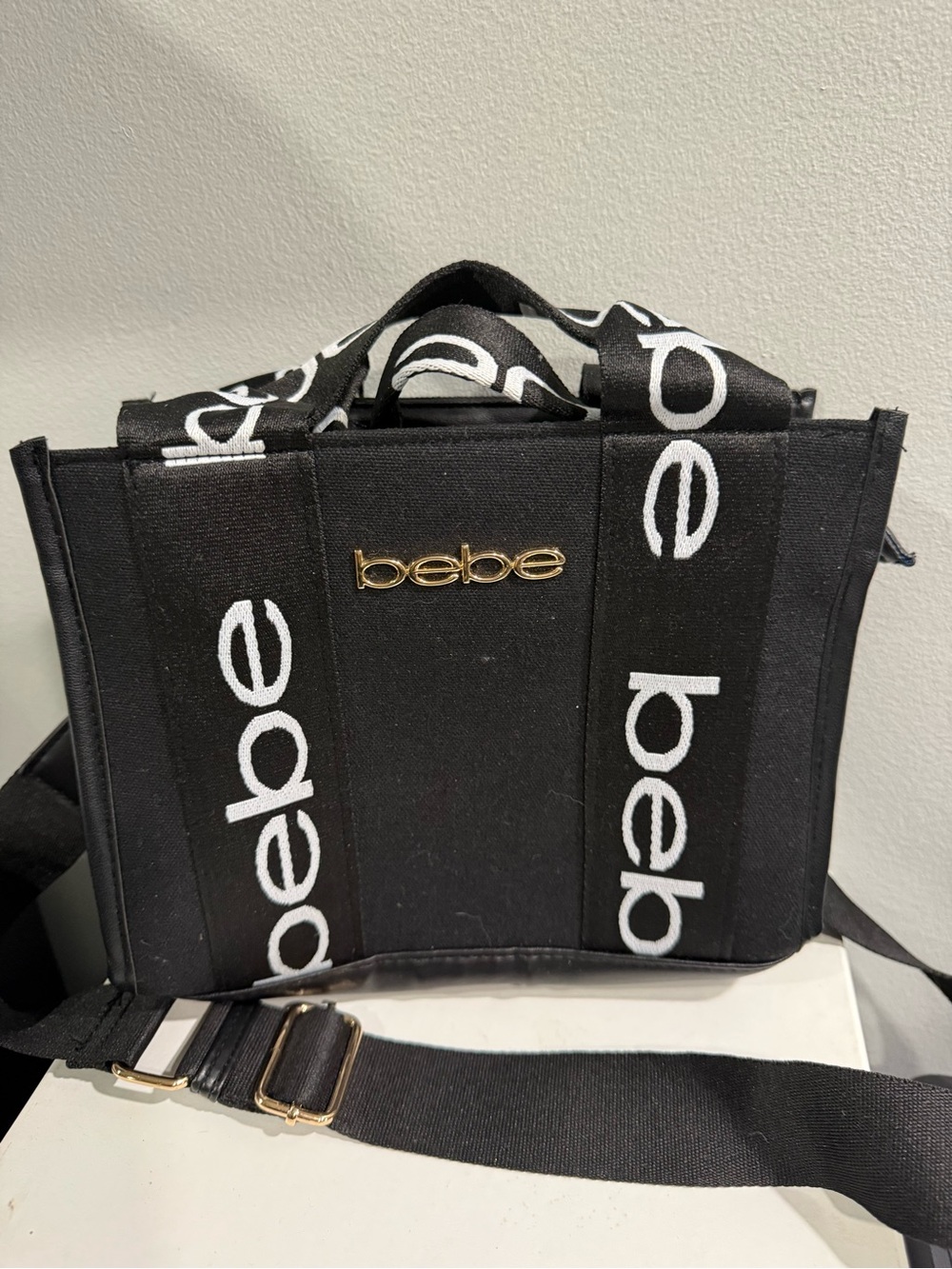 bebe Black Canvas Logo Messenger Bag with Gold Emblem